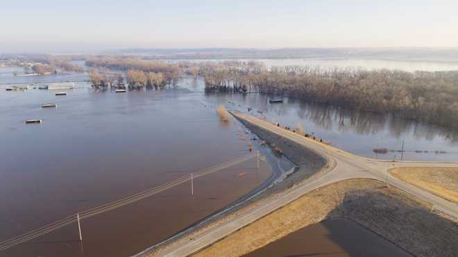 The rivers kept raging Sunday as more Nebraskans and Iowas fled to shelters